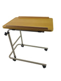 Wooden overbed table with adjustable height on 4 castors with a white background