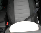 Car seat with a white turning cushion on a black background